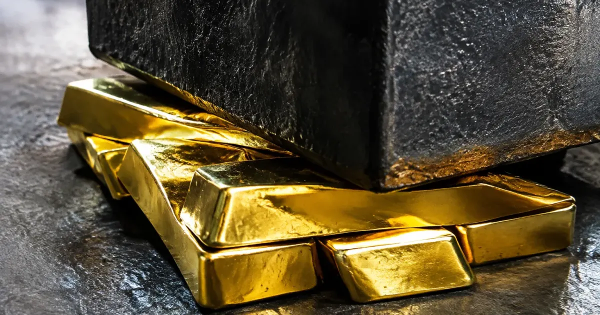 Lingotti metallici schiacciati da blocchi neri massicci