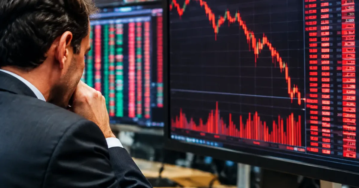 Schermi di borsa mostrano numeri rossi in calo